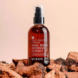Atjaunojoša esence ar gliemežu mucīnu Mizon Snail Repair Intensive Essence